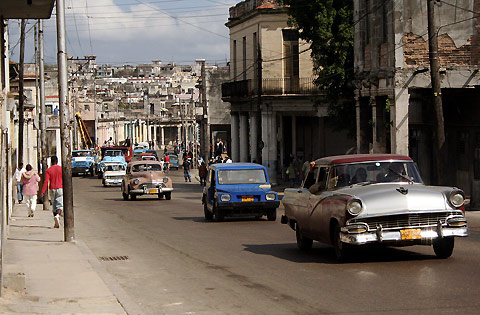 Havana, Cuba. The complete lack of freedom has created nearly zero innovation (thus the automobiles in the photograph that are leftover from the 50's era) and poverty. 