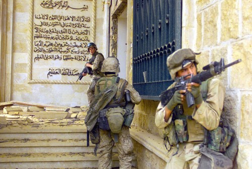 U.S. Marines enter a palace during the Fall of Baghdad, 2003. 