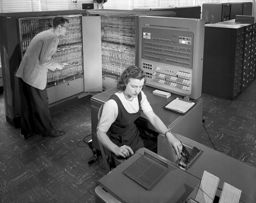 NACA researchers (later NASA) using an IBM type 704 electronic data processing machine in 1957. 