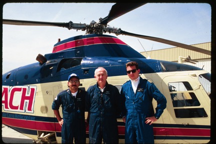 Dr. McDonald with REACH helicopter and two crew members